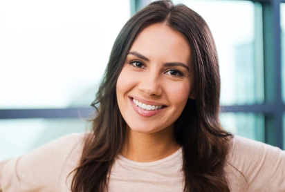 Woman smiling comfortably, sedation dentistry patient